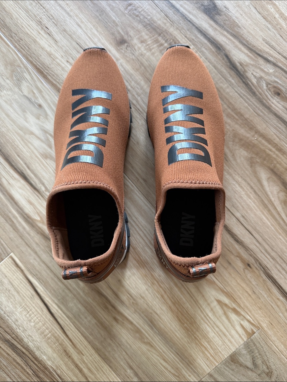DKNY Women's Slip-On Sneakers in Rust Orange with Black Logo